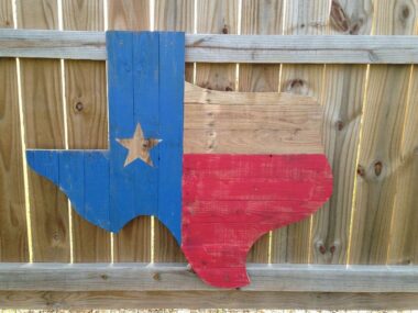 A wooden sign shaped like the state of Texas