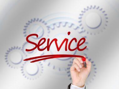 The word Service with gears behind it