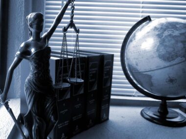 A statue of Lady Justice on a desk