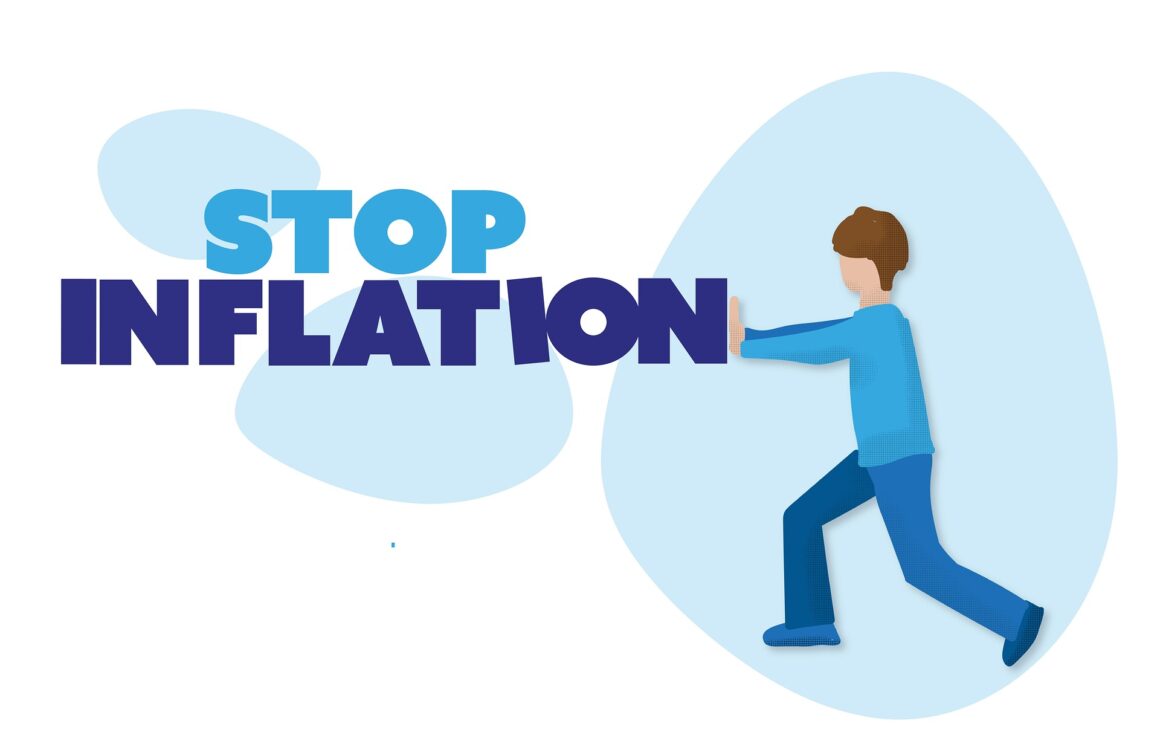 a man pushing the words "stop inflation"