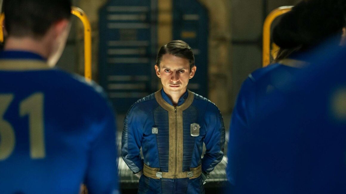 Norm MacLean with dwellers from Vault 31 in Fallout