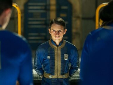 Norm MacLean with dwellers from Vault 31 in Fallout