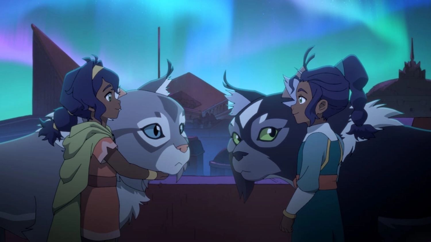 Pavi and her cat monkey Geet (left) with her twin sister Nisha and her cat monkey Ruhi (right) 